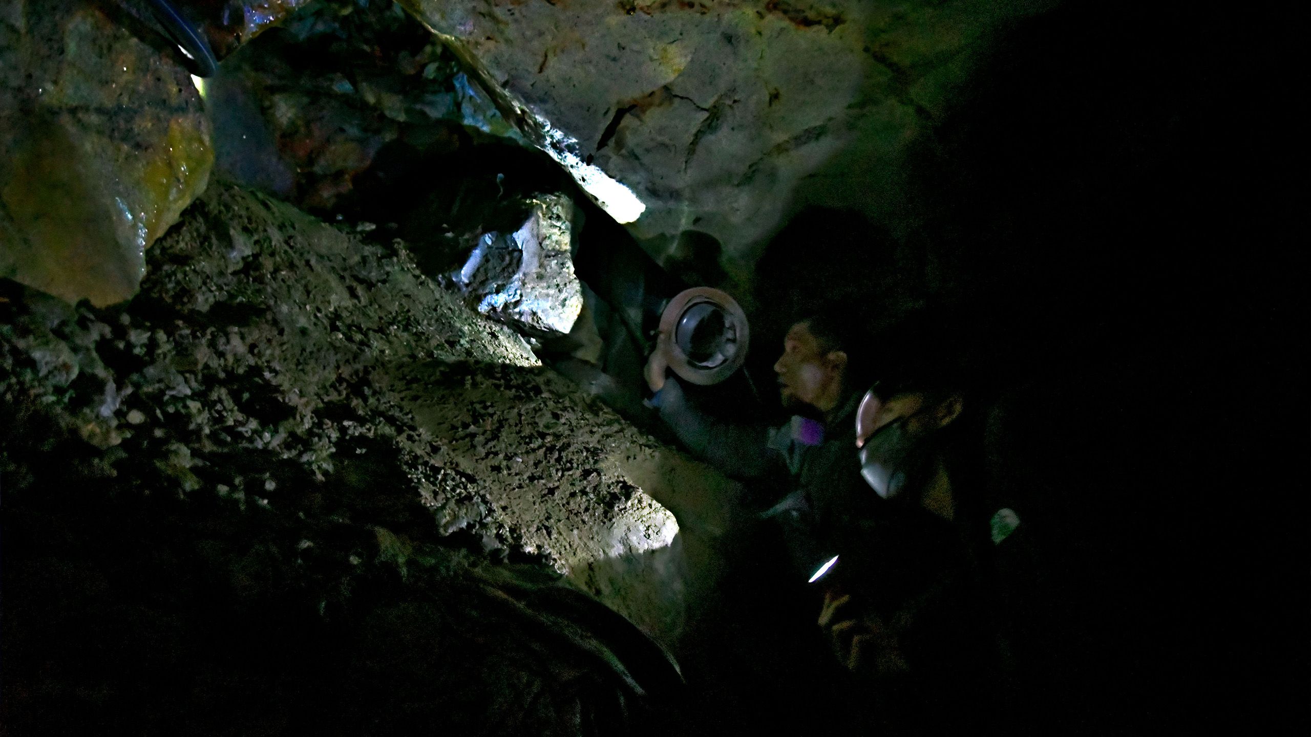 A worker is looking at a shaft.